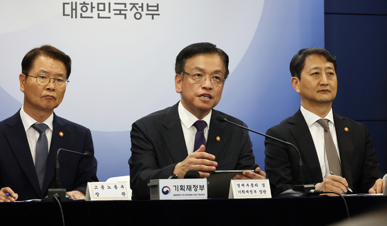 Finance Minister Choi Sang-mok, center, speaks during a press conference on the Dynamic Economy Roadmap and the economic policy direction for the second half of the year held at the government complex in central Seoul on Wednesday. [YONHAP]