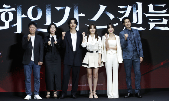From left, director Park Hong-kyun, actors Seo Yi-sook, Jung Ji-hoon, Kim Ha-neul, Ki Eun-se and Jung Gyu-woon pose for a photo at a press conference for the Disney+ series ″Red Swan″ in Yeongdeungpo District, western Seoul, on Tuesday. [NEWS1]