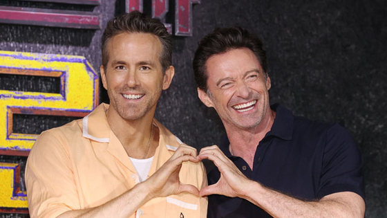 Actors Ryan Reynolds, left, and Hugh Jackman pose for the cameras during a press conference for the upcoming Marvel superhero action movie ″Deadpool & Wolverine″ at the Four Seasons Hotel Seoul in Jongno District, central Seoul, on July 4. [YONHAP]