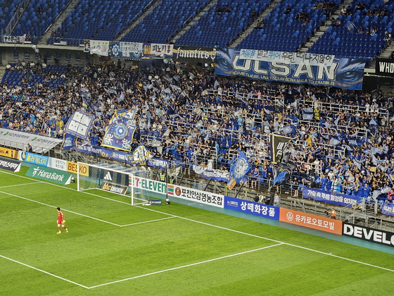 Spectators during a K League 1 match between Ulsan HD and Gwangju FC at Munsu Football Stadium in Ulsan on Wednesday wave flags to support Ulsan. [PAIK JI-HWAN]