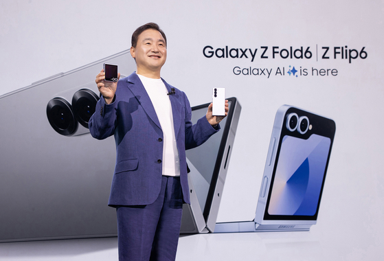Roh Tae-moon, president and head of the mobile businss division at Samsung Electronics poses with the new foldables at the Galaxy Unpacked 2024 event in Paris on Wednesday. [SAMSUNG ELECTRONICS]