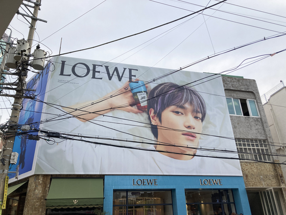 Boy band NCT's Taeyong as brand ambassador for Loewe, as pictured on an advertisement in a store in Seongsu-dong, eastern Seoul. [KIM JU-YEON]