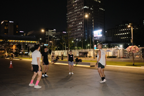 Warmups in the plaza. [HAN STRIDE]