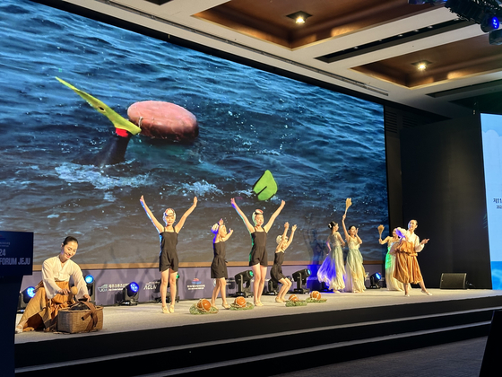 Artists perform during a haenyeo show at the 11th Jeju International Cruise Forum at Maison Glad Jeju in Yeongdong, Jeju on July 10. (JEJU TOURISM ORGANIZATION)