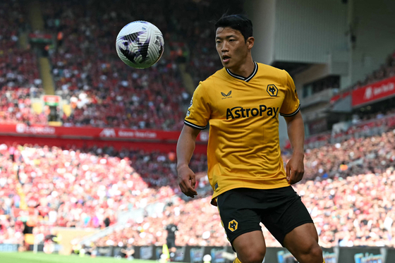 Wolverhampton Wanderers' Hwang Hee-chan eyes the ball during a Premier League match against Liverpool in Liverpool on May 19.  [AFP/YONHAP]
