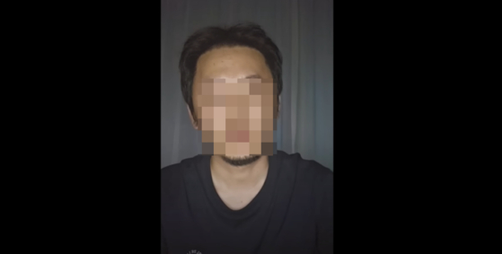 A man surnamed Lee appears in an apology video posted on YouTube channel named ″Miryang The Glory″ on Sunday. His identity was doxxed last month for his involvement in the 2004 Miryang gang rape case. [SCREEN CAPTURE]