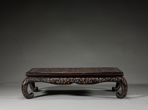 A Chinese table with cloud design made with carved lacquer from the 14th to 17th century [NATIONAL MUSEUM OF CHINA]