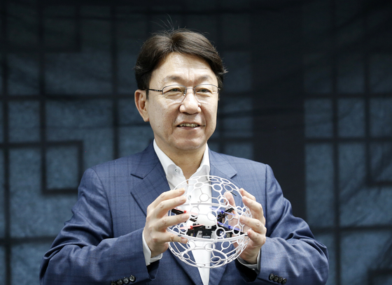 Jeonju Mayor Woo Beom-ki holds a drone soccer ball during an interview with the JoongAng Sunday at his office in Wansan District, Jeonju, North Jeolla, on June 27. [JEONJU CITY GOVERNMENT] 