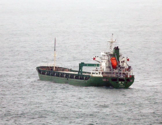 The stateless 3,000-ton ship De Yi is forced to dock in waters off Gamcheon Port in Busan on April 3, 2023. South Korean authorities reportedly seized the ship recently in territorial waters, suspecting it of violating U.N. sanctions on North Korea. [YONHAP]