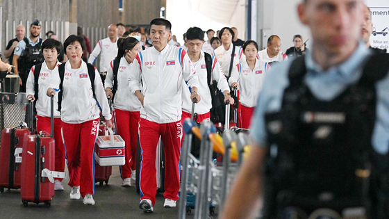 North Korean athletes competing in the 2024 Paris Olympics arrive at Paris Charles de Gaulle Airport in France on Saturday. [JOINT PRESS CORPS]