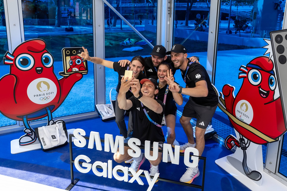 Team Germany athletes take a selfie together holding a Samsung Galaxy Z Flip6 Olympic Edition at the Olympic Village. [SAMSUNG ELECTRONICS]
