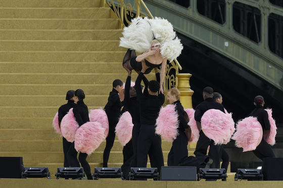 Lady Gaga performs during the opening ceremony for the Paris Olympics.  [AP/YONHAP]