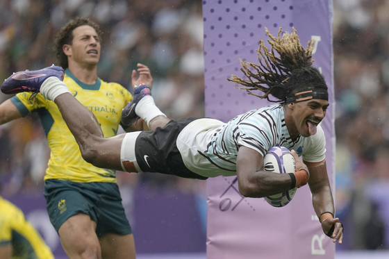 Fiji's Selesitino Ravutaumada goes over the line to score a try during the men's semifinal Rugby Sevens match between Fiji and Australia at the Paris Olympics, in the Stade de France, in Saint-Denis, France on Saturday. [AP/YONHAP] 