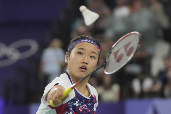 Korea's An Se-young plays against Bulgaria's Kaloyana Nalbantova during their women's singles badminton group stage match at Port de la Chapelle Arena at the Paris Olympics in Paris on Sunday. [AP/YONHAP] 