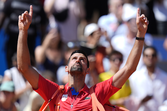 Serbia's Novak Djokovic gestures as he leaves the court after defeating Spain's Rafael Nadal in their men's singles second-round match at the Roland Garros Stadium at the 2024 Paris Olympics on Monday in Paris, France. [AP/YONHAP]