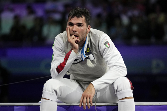 Italy's Filippo Macchi reacts after losing the men's individual foil final match against Hong Kong's Cheung Ka Long during the 2024 Paris Olympics at the Grand Palais on Monday in Paris. [AP/YONHAP]