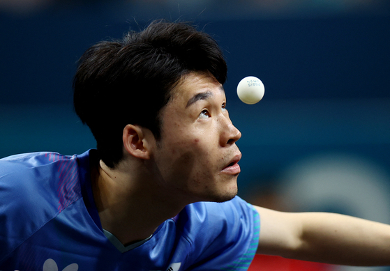 Korea's Jang Woo-jin in action during his quarterfinal match against Hugo Calderano of Brazil at the Paris Olympics on Thursday. [REUTERS/YONHAP]