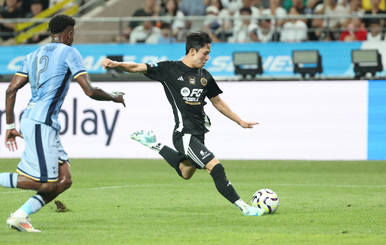 Yang Min-hyuk shoots during a Coupang Play Series match between Team K League and Tottenham Hotspur at Seoul World Cup Stadium in western Seoul on Wednesday. [YONHAP]