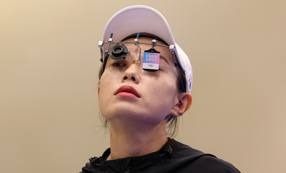 Kim Ye-ji prepares to shoot for the women's 10-meter air pistol final at the Chateauroux Shooting Centre in France on July 28. [GETTY IMAGES]