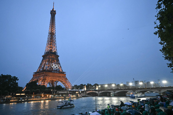 Solomon Islands' delegation sail in a boat along the river Seine during the opening ceremony of the Paris Olympics on July 26.  [AFP/YONHAP]