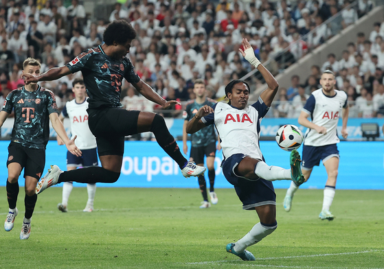 Bayern Munich's Serge Gnabry, left, shoots during a Coupang Play Series match against Spurs at Seoul World Cup Stadium in western Seoul on Saturday. [NEWS1] 