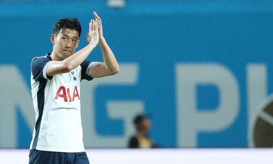 Spurs captain Son Heung-min claps before being substituted off the pitch in the second half of a match against Bayern Munich at Seoul World Cup Stadium in western Seoul. [NEWS1]