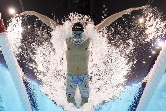 Kristof Milak of Hungary swims in the men's 100-meter butterfly at La Defense Arena in Paris on Saturday.  [REUTERS/YONHAP]