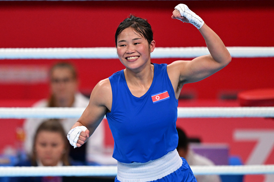 North Korea's Pang Chol-mi celebrates winning gold in the women's bantamweight at the Hangzhou Asian Games in Hangzhou, China on Oct. 4, 2023. [XINHUA/YONHAP]