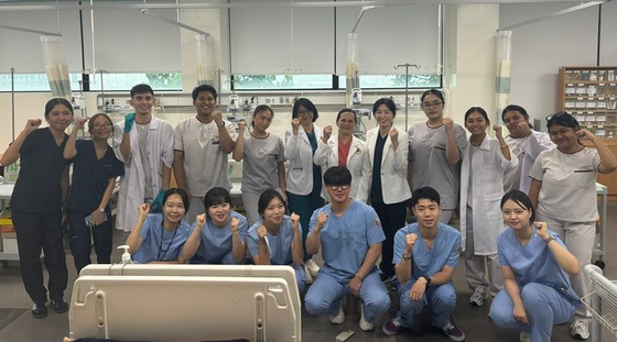 Philippine students invited through Daegu Health College's Global Internship Exchange program pose for a photo with the Korean university's students. [DAEGU HEALTH COLLEGE]