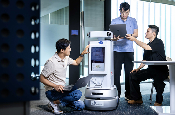 SK Telecom researchers test autonomous delivery robots in the mobile carrier's Pangyo building in Gyeonggi. [SK TELECOM]