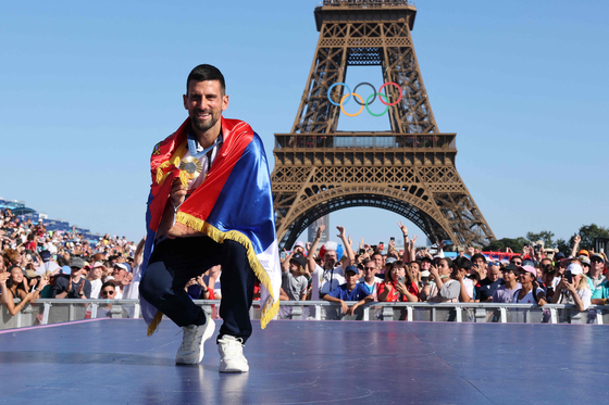 Serbia's Novak Djokovic, gold medalist in the men's tennis singles, poses at Champions Park in Paris on Monday. [AFP/YONHAP]