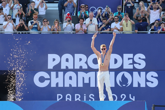 French swimmer Leon Marchand poses at Champions Park on Tuesday. [AFP/YONHAP]