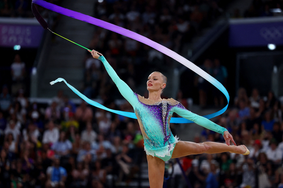 Ekaterina Vedeneeva of Slovenia performs with ribbon during the Paris Olympics rhythmic gymnastics final at Porte de La Chapelle Arena in Paris on Friday. [REUTERS/YONHAP] 