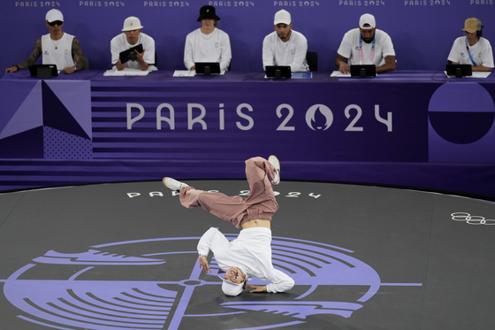 Japan's Ami Yuasa, known as B-Girl Ami, competes during the breaking quarterfinals in Paris on Friday. [AP/YONHAP]