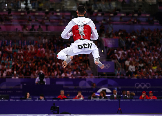 Edi Hrnic of Denmark warms up before his bout against Leon Sejranovic of Australia in the men's -80-kilogram taekwondo repechage round in Paris on Friday. [REUTERS/YONHAP]