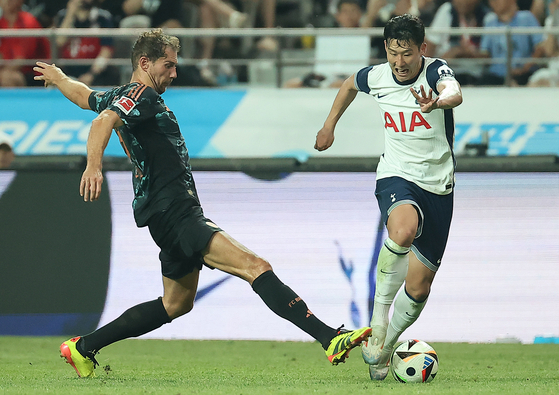 Tottenham Hotspur's Son Heung-min, right, in action during the friendly against Bayern Munich at Seoul World Cup Stadium in western Seoul on Aug. 3. [NEWS1]