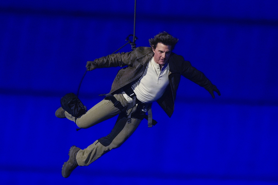 Tom Cruise is lowered on the Stade de France during the Paris Olympics closing ceremony in Saint-Denis, France on Sunday. [AP/YONHAP]