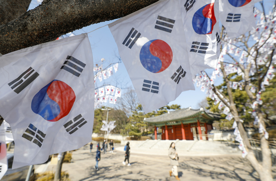 Hyochang Park in Yongsan District, central Seoul, has taegeukgi, the Korean flag, hanging on trees for the March 1 Independence Movement Day. [NEWS1]