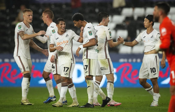 Swansea players celebrate during their Carabao Cup match against Gillingham on Aug. 14 at Swansea.com Stadium in Swansea, Wales in a photo shared to Instagram by Azeem Abdulai. [SCREEN CAPTURE]