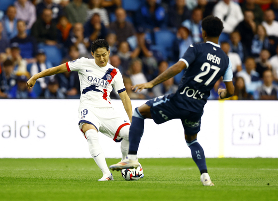 Paris Saint-Germain's Lee Kang-in scores their first goal in the third minute in a match against Le Havre in Le Havre, France on Friday. [REUTERS/YONHAP]