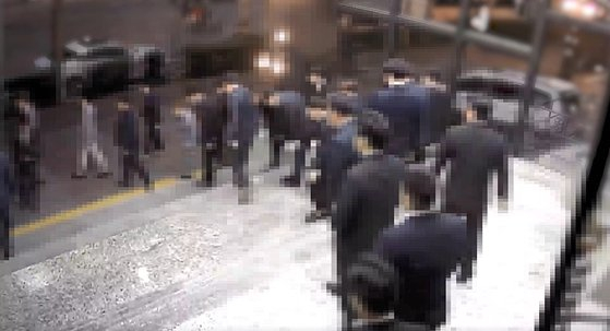 Members of the ″Anyang Tigers″ gang bow to its leaders as they leave the 80th birthday party of a gang member's mother. [GYEONGGI NAMBU PROVINCIAL POLICE]