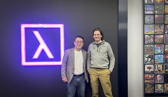 SK Telecom CEO Ryu Young-sang, left, and Lambda founder Stephen Balaban pose for a photo after discussing the two companies' potential partnership at Lambda's headquarters in California in January. [SK TELECOM]