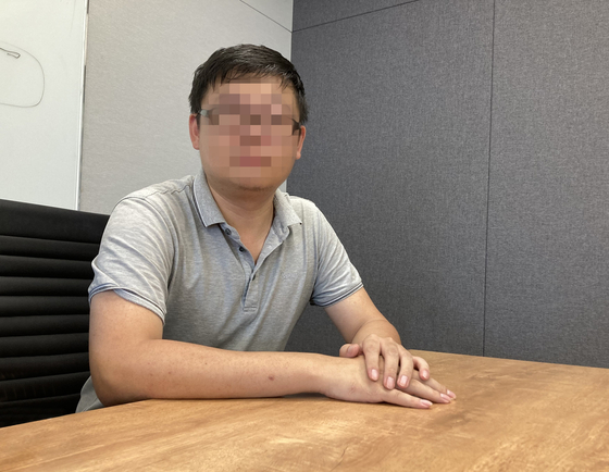 Li Yeqi, CEO of LKQ Group and Zhengzhou YC, sits down for an interview with the Korea JoongAng Daily on Aug. 12. He claims his businesses have not received $5.7 million in due payments from Qoo10 and its affiliates. Li requested his face be blurred for online publication. [KIM JU-YEON]