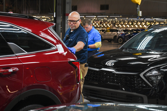 A Kia employee produces vehicles at its plant in Georgia. [KIA]