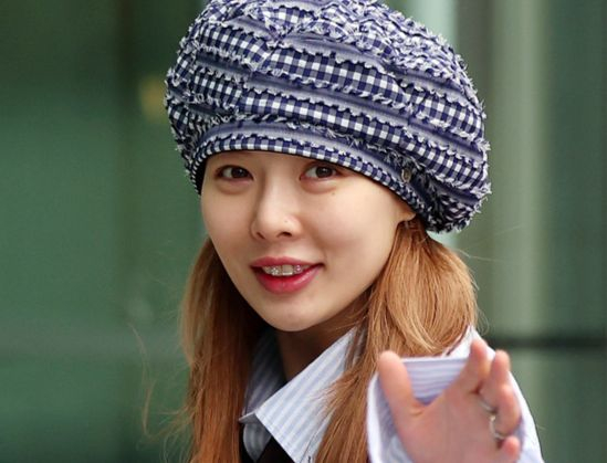 HyunA waves to fans as she heads to the SBS television network in Yangcheon District, western Seoul, on May 7, 2024. [NEWS1]