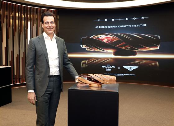  Edrington’s managing director of the North Asian region, Martin Jaime, poses for the camera next to the bottle of The Macallan Horizon, after an interview with the local press ahead of the launch held at the Bentley Tower in Dongdaemun District, eastern Seoul.[PARK SANG-MOON]