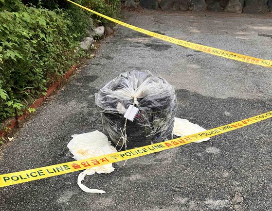 A fallen trash balloon is seen on a road in Chuncheon, Gangwon, on Saturday. [YONHAP]