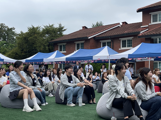 Participants in the American Diplomacy House Academy listen to opening remarks delivered by Joy Sakurai in a kick-off ceremony on Friday in central Seoul. [LEE SOO-JUNG]