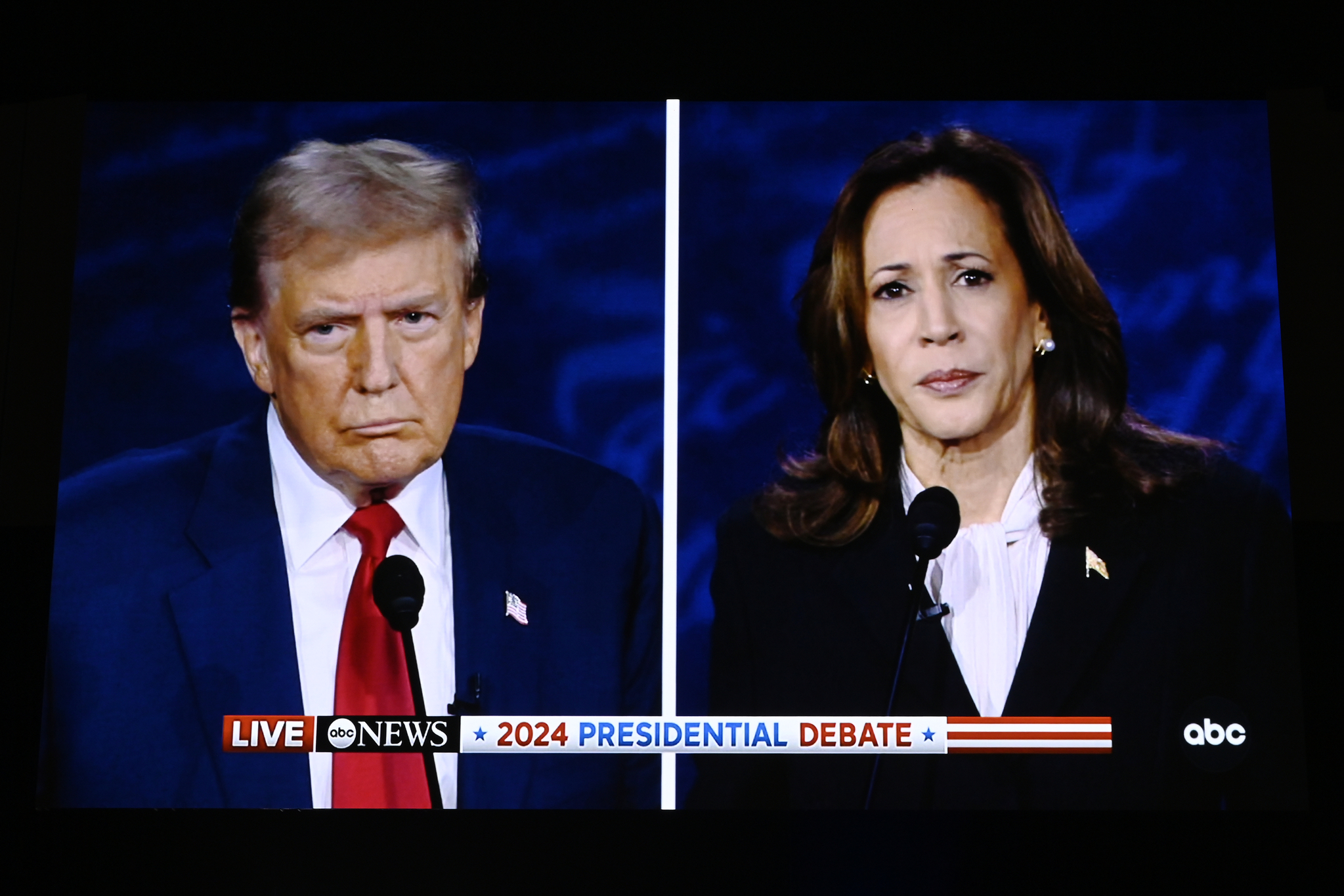 A monitor shows former President Donald Trump, left, and U.S. Vice President Kamala Harris during a presidential debate in Philadelphia, Pennsylvania, on Tuesday. [XINHUA/YONHAP]