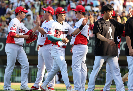 The Kia Tigers celebrate winning a KBO game against the Kiwoom Heroes at Gwangju-KIA Champions Field in Gwangju on Sept. 8. [YONHAP] 